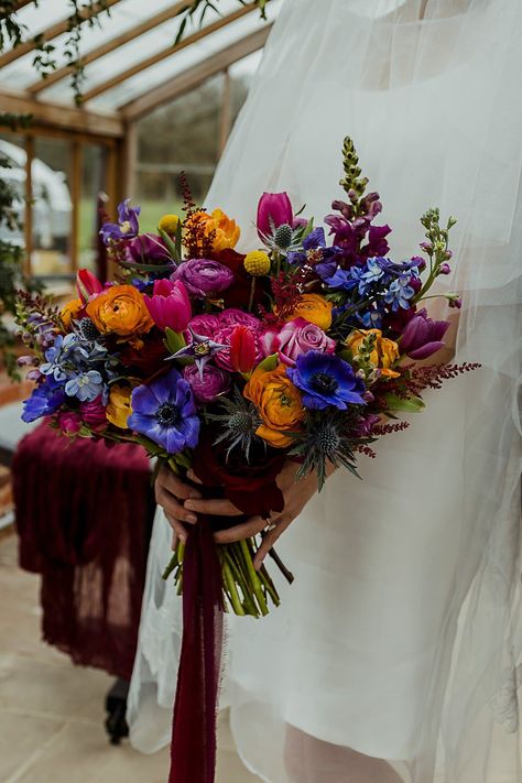 Somersbury Barn Wedding Thorn and Found Colourful Spring Bouquet Flowers Bride Bridal Orange Purple Blue Pink #wedding #weddingbouquet Fall Flowers Bouquet, Wedding Fall Flowers, Jewel Wedding Colors, Jewel Tone Wedding Flowers, Blue Orange Weddings, Orange Purple Wedding, Barn Wedding Ideas, Blue Purple Wedding, Flowers Colourful