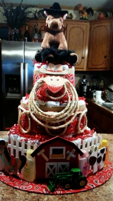 Cowboy diaper cake Baby Shower Diaper Cake Ideas, Tractor Diaper Cake, Diaper Cake Ideas, Diy Diaper Cake, Diaper Gifts, Farm Baby Shower, Cowboy Baby Shower, Diaper Cake Boy, Cowboy Baby