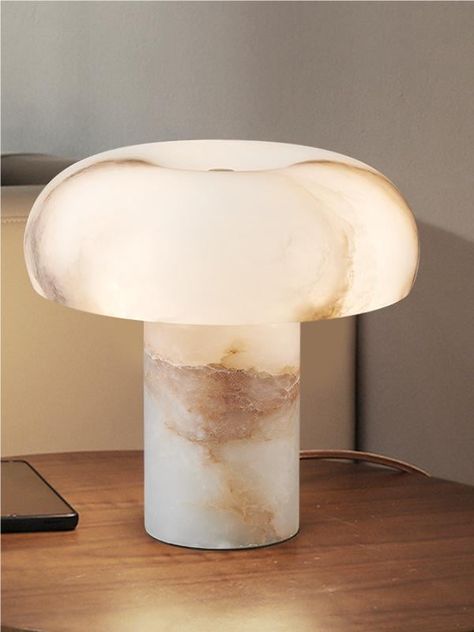 Experience a touch of magic and elegance with our alabaster table lamp. This enchanting piece of art is carefully handcrafted using premium quality alabaster,