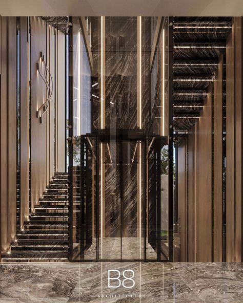 Villa Maré / Interior Design - B8 Architecture and Design Studio Staircase Design Modern With Lift, Luxury Stairs With Elevator, Modern Elevator Interior, Classic Hotel Design, Double Height Entrance Foyer, Luxury Staircase Design, B8 Architecture, Classical Villa, Luxury Stairs