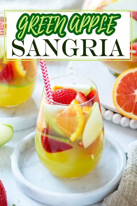 Looking for a refreshing fruity cocktail? Try this easy green apple sangria recipe! Crisp green apples, sweet white wine, and zesty lemon, make this the pitcher-perfect addition for pool parties, porch sippin,’ or girls night in. Olive Garden Apple Sangria Recipe, Green Apple Sangria Olive Garden, Olive Garden Sangria, Green Apple Sangria, Green Apple Moscato Sangria, Apple Sangria Recipes, Moscato Sangria, Apple Sangria, Apple Wine