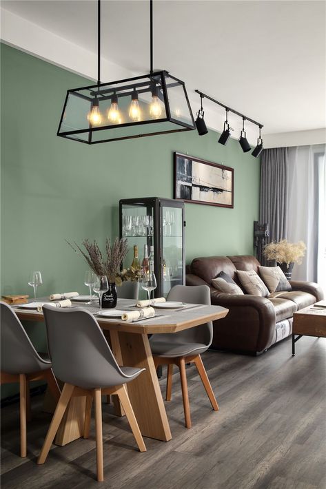 Grey Tulip Chairs With Wooden Legs are harmonious collocation with the light olive green background wall. Wooden Wall Living Room, Olive Living Rooms, Living Room Wooden Wall, Grey Flooring Living Room, Green Walls Living Room, Light Green Walls, Wooden Wall Design, Olive Green Walls, Green Accent Walls