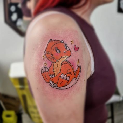 Cera from Land before time for todays client. #tattoostudio #tattoo #tattoos #tattooartist #inked #tattooart #tattooshop #tattooed #tattoolife #tattooing #art #tattooist #tattooink #tattooer #tattoodesign #tattoostyle #tattooideas #tattoolove #instatattoo #artist #flashworker #tattoomodel #tattooinspiration Land Before Time Tattoo, Little Foot Tattoos, Disney Sleeve Tattoos, Minimal Tattoo Designs, The Land Before Time, Dinosaur Tattoos, Movie Tattoos, Land Before Time, Creepy Tattoos