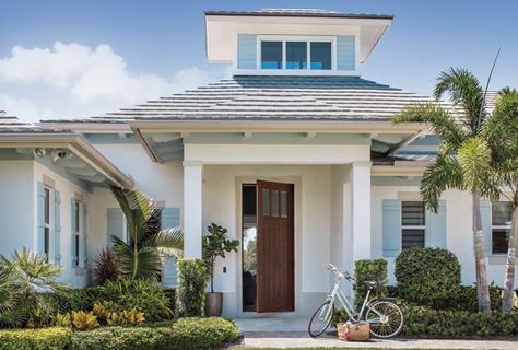 Krista   Home Designs A Comfortable Juno Beach Waterfront Home White House With Blue Shutters, Margaritaville Parrot, Brick Paint Colors, Coastal Houses, White Exterior Paint, Florida Cottage, Florida Beach House, Palmer House, Porch Styles