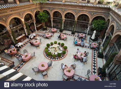 Courtyard, Hotel Alfonso XIII, Seville, Spain Stock Photo Maroco Style, Arabian House Design, Hall Construction, Arabian Nights Aesthetic, Kit Net, Courtyard Restaurant, Seville Hotel, Courtyard Hotel, Moroccan Riad