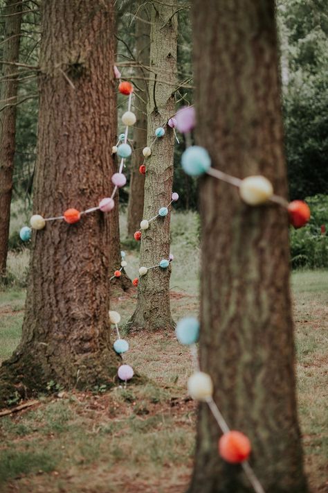 Camp Wedding Decorations, Summer Woodland Wedding, Campy Wedding, Garland Trees, Woodland Festival, Wedding Outdoor Decoration, Festival Wedding Ideas, Pom Pom Wedding, Camp Themed Wedding