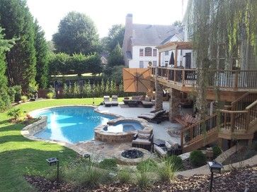 pool area and patio from walkout basement Walkout Basement Patio, Patio Under Decks, Curved Patio, Cozy Ideas, Stone Pool, Tropical Pool, Luxury Pools, Backyard Pool Landscaping, Walkout Basement