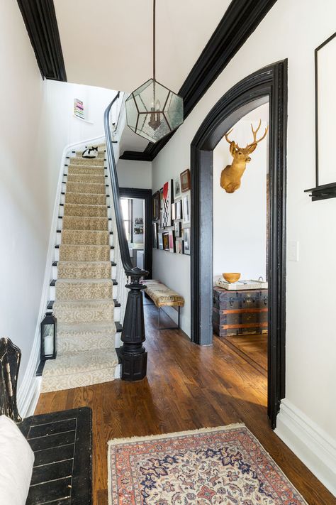 The homeowners flipped the home so the top two floors could be the owner's duplex with a garden rental. Interior Contemporary Design, Black Baseboards, Black Trim Interior, Brownstone Interiors, White Baseboards, Dark Trim, Black Floor Tiles, Brooklyn Brownstone, White Wall Tiles