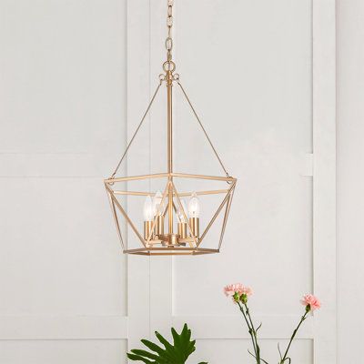 A glamorous design is given a minimalist, modern flair in this unique pendant light. It comes in a brushed rose gold finish with a four-light construction. Boasting an airy, modern look, this lantern geometric chandelier is sure to fit right in with most contemporary living spaces. its traditional lantern style features a luxurious finish that illuminates its minimalist lines and curves and modern suspended inner candelabra. | Everly Quinn 4 - Light Lantern Geometric Chandelier Metal in Brown | Lantern Pendant Lighting Brass, Gold Cage Pendant Light, Gold Hanging Lights, Gold Chandelier Geometric, Gold Nickel-free Brass Chandelier Earrings, Black And Gold Geometric Pendant Light, Unique Pendant Lights, School House Lighting, Traditional Lanterns