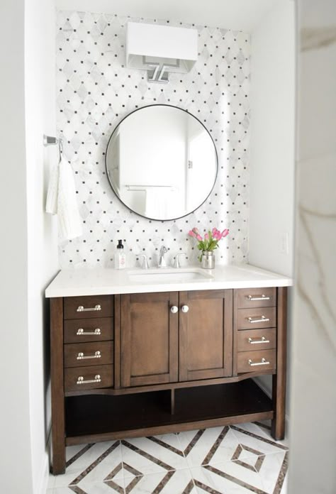 BATHROOM | Hall Bathroom Makeover. Beautiful small bathroom with accent tile in a warm toned marble with wood vanity and round mirror Flip House, Bad Inspiration, Hall Bathroom, Subway Tiles, Basement Bathroom, Bathroom Redo, Powder Rooms, Bathroom Renos, Bath Ideas