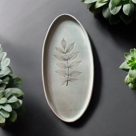 This is one of my new large oval platters with leaf impressions from the field in which my Luna 🐴 grazes. I love the shape and how the stain has created shading of the leaf making it even more beautiful. Dimensions 15” x 7” x 1” Ceramic Platter, Ceramic Ideas, Oval Platter, The Leaf, The Shape, Ceramic Plates, The Field, Cute Jewelry, Stain