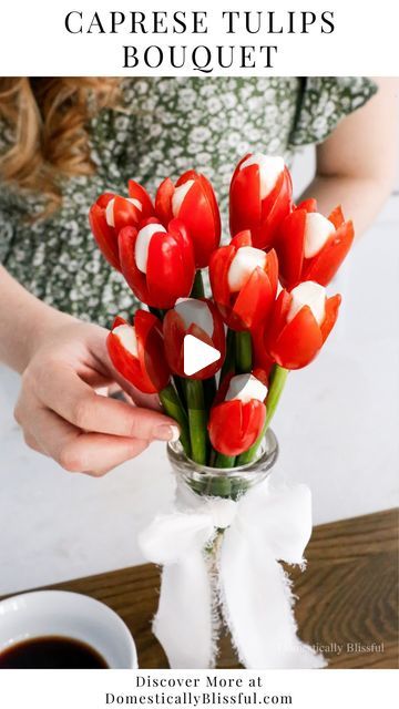 3M views · 95K likes | Giustina | DIYs • Recipes • Home Inspiration on Instagram: "Like + Comment “Link” to instantly get the links, recipes, & details in your DM.

Years ago (in 2018 – can you believe that was 6 years ago!?) I made a Cherry Tomato Tulip Bouquet, filled with a goat cheese/cream cheese herb filling.

It was so good!!

I decided to make it again, but a little bit simpler with a mini mozzarella ball in the center this time.

The scallions can be eaten (as I know some people love them as is) or they can be washed and reused to make other recipes!

This is such a fun and easy recipe for a spring party or Easter brunch, and you only need 3 ingredients!

I served this Caprese Tulips Bouquet with balsamic vinegar with a sprinkle of black pepper, but you could also serve it with sa Mini Mozzarella Balls, Spring Appetizers, Tulips Bouquet, Quick Appetizers, Charcuterie And Cheese Board, Tulip Bouquet, A Goat, Mothers Day Brunch, Cherry Tomato