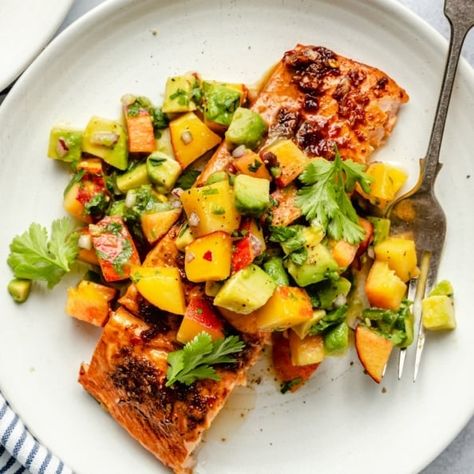 Delicious sweet and spicy firecracker salmon topped with a wonderful, fresh peach avocado salsa. This firecracker salmon recipe can be baked or grilled for a healthy weeknight meal that everyone will love! Serve with your favorite sides, rice, quinoa or even in tacos. Firecracker Salmon Recipes, Peach Salsa Recipe, Firecracker Salmon, Recipe For Salmon, Peach Salsa Recipes, Avocado Recipes Healthy, Salmon Soy Sauce, Peach Salsa, Delicious Seafood Recipes