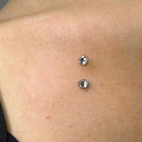 What type of dermal piercing will you choose? Should it be chest, neck, facial or unique sternum variation? #glaminati #dermalpiercing #dermals #dermalpiercingideas #chestdermalpiercing #piercingideas #womanpiercing #piercingideasforwoman Chest Piercing Dermal, Piercing Between Breast, Sternum Piercing Dermal, Dermal Piercing Ideas, Piercing No Rosto, Dermal Piercing Chest, Chest Dermal, Sternum Piercing, Face Dermal Piercing