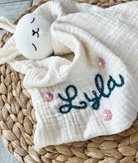 "To see more color variations, please visit my Instagram @CozyStitchesByAsh *These hand embroidered personalized lovies are perfect for a baby shower gift, monthly baby pictures or birth announcements.  *100% cotton, 15 x 15 inches.  *If you have a design idea in mind please message me. I'm happy to create other designs.  *Be sure to include your preference for each color in the personalization box. *The \"Lyla\" example shown is using thread colors 3 and 31. CARE INSTRUCTION To get the most out Monthly Baby Pictures, Handmade Baby Shower Gift, Monthly Baby, Handmade Baby Gifts, Baby Embroidery, Embroidered Gifts, Baby Lovey, Personalized Baby Blanket, Hand Embroidery Projects