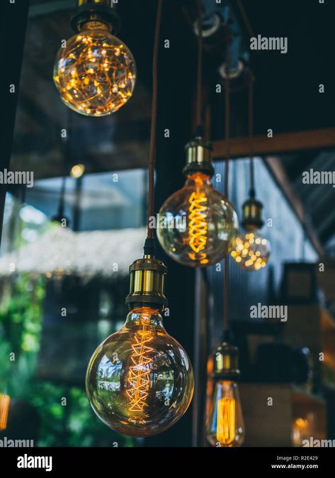 Decorative antique edison vintage style light bulbs on cafe background vertical style Stock Photo - Alamy Cafe Background, Styled Stock Photos, Styled Stock, Lantern Lights, Light Bulbs, Lanterns, Vintage Style, Photo Image, Stock Images