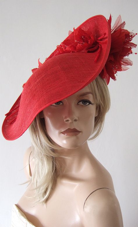 Modern Slice Wavy Headpiece, with handmade silk roses with Swarovski Crystals. A Large Wavy Saucer that has a beautiful upturned back that holds a bed of handmade Red silk Roses with dozens of Swarovski Crystals stamen centres, and repeated Flowers on the underside. Red Mother of the Bride Hats. Red Wedding Guest Hats. Hats for Royal Ascot. What to wear for Royal Ascot. Wedding Hat Hire. Hat Hire for Wedding. Bride Hats, Wedding Hats For Guests, Royal Ascot Races, Mother Of The Bride Hats, Red Fascinator, Royal Ascot Hats, Run For The Roses, Occasion Hats, Ascot Hats