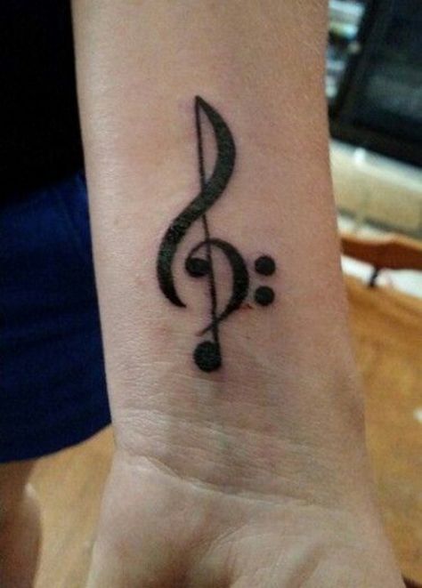 One example of a beautiful tattoo that depicts one’s love for music is the treble clef tattoo. The treble clef refers to the musical symbol that is used by musicians in the form of notations. Treble Clef And Bass Clef Tattoo, Treble Clef Bass Clef Tattoo, Music Note Semi-colon Tattoo, Treble And Bass Clef Tattoo, Clef Tattoo, Music Symbol Tattoo, Semicolon Tattoo Meaning, Treble Clef Tattoo, Music Notes Tattoo