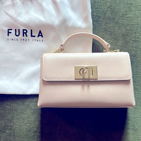 Nwt Furla 1927 Mini Nude Crossbody With Gold Chain. In Perfect Condition Never Used Purchased In Rome. Amazing Leather Quality. Original Tags, Certifications, And Satin Lined Dust Bag Included. Dimensions: 6,5 X 3,94 X 1,69 (W X H X D) Furla 1927, Furla Bags, Photo Dimensions, Mini Crossbody, Price Tag, Gold Chain, Top Handle, Gold Chains, Rome