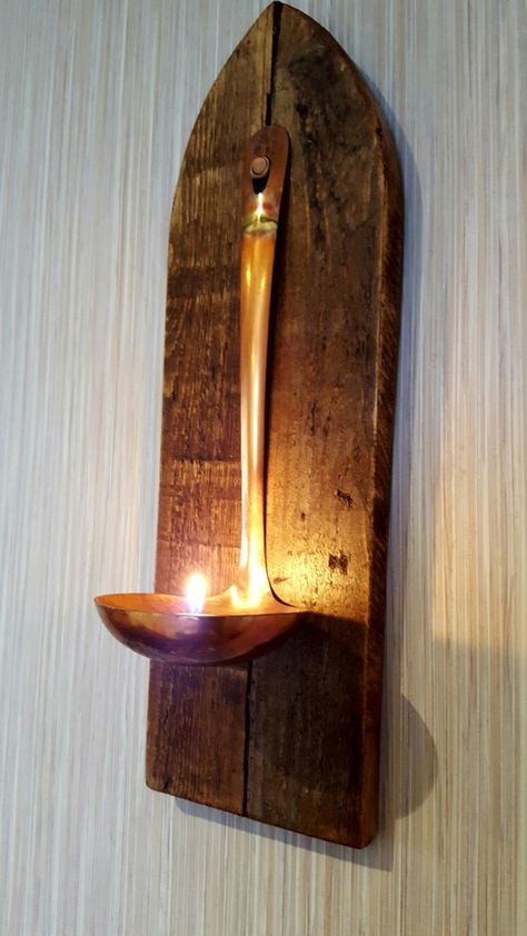 Wall mounted tealight holder, which I made from pallet wood, and an old copper ladle. By: Kenny Hamilton. The Driftwood Collector Wall Tealight Holder, Copper Ladle, Tealight Holder, Pallet Wood, Light Holder, Tealight, Wood Pallets, Tea Light Holder, Winter Decor