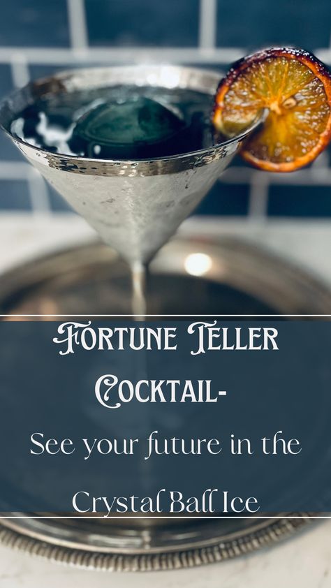 Fortune Teller Cocktail with dark blue ice sphere and candied orange garnish. Fortune Teller Birthday Party, Psychic Party Ideas, Full Moon Cocktail, Mystical Cocktails, Speakeasy Food, Magical Cocktails, Seance Party, Psychic Party, Ice Sphere