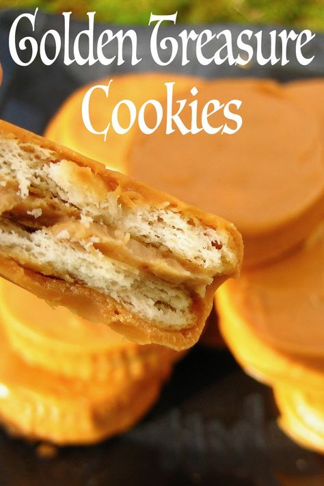 A cross-section of a Golden Treasure Cookie highlighting the flaky crumb and creamy peanut butter filling. A plate of stacked Golden Treasure Cookies are in the background. Treasure Cookies, Butterscotch Peanut Butter, Peanut Butter Crackers, Golden Treasure, Chocolate Covered Peanuts, Cracker Cookies, Peanut Butter Filling, Buttery Cookies, Ritz Crackers