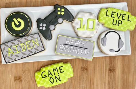 Lisa on Instagram: “Gamer themed birthday party. That green is one of my very favorite colors😍. #gamercookies #levelupcookies #playstationcookies…” Level 10 Birthday Party, Gamer Cookies, Level Up Birthday Party, Gamer Themed Birthday Party, Video Game Cookies, Gaming Birthday Cookies, Gamer Cookies Decorated, Gamer Birthday Party Ideas, 10th Birthday Boy Party Themes