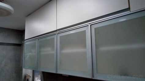 Glass Profile Kitchen Overhead Shutter Profile Glass Doors Kitchen, Profile Shutter Kitchen, Glass Profile Shutter Kitchen, Profile Doors Kitchen, Contemporary Crockery Unit, Profile Shutter, Crockery Unit Ideas, Modern Crockery Unit, Modern Crockery