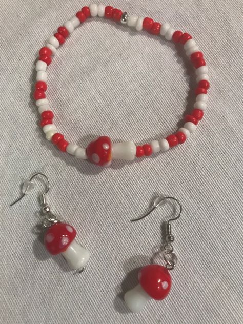 Red mushroom bracelet and earrings Mushroom Accessories, Mushroom Bracelet, Im Okay, Diy Kandi Bracelets, Beaded Braclets, Bracelet Stand, Red Mushroom, Kandi Bracelets, Bead Charms Diy