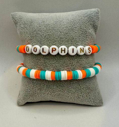 Miami Dolphins Bracelets, Elastic Beaded Bracelets, Swiftie Bracelets, Bracelet Board, Dolphin Bracelet, Moon Tattoos, Preppy Bracelets, Elastic Bracelets, Bracelet Inspiration