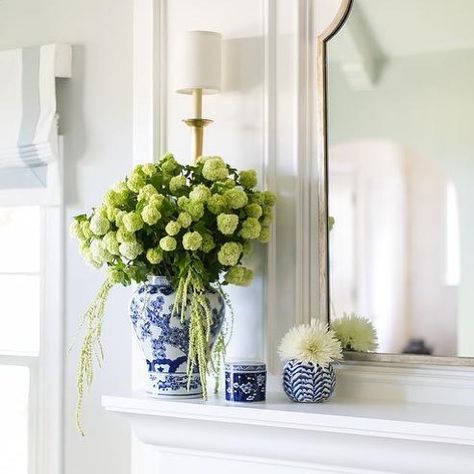 A few blue and white ginger jars can really elevate the look of a space. I love how designer Lauren Evans used them to decorate this… Blue And White Vases Decor, White Mantle, Tudor Cottage, Townhouse Interior, Fireplace Mantle Decor, Mantel Design, White Ginger Jars, White Fireplace, Blue And White Vase