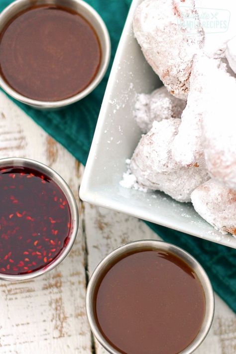 These Dipping Sauces are all so yummy! Chocolate Hazelnut, Butterscotch Caramel, and Vanilla Raspberry sauces are all especially good with our beignets. #dippingsauce #chocolatesauce #raspberrysauce #caramelsauce #FavoriteFamilyRecipes Beignet Recipe, Baked Recipes, Mardi Gras Food, Disney Recipes, Dipping Sauces, Raspberry Sauce, Dessert Toppings, Dessert Sauces, Chocolate Sauce