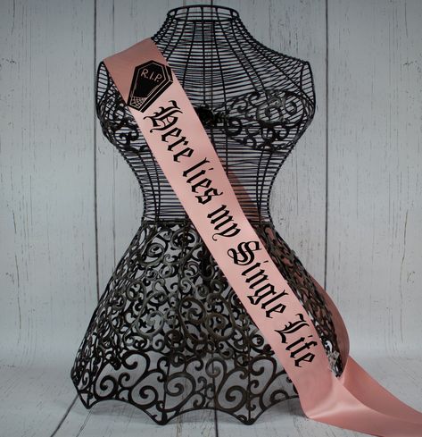 The sashes are 3 inches wide by 72 inches in length. The sash is kept open at the ends and heat sealed to stop fraying. You can use a small pin that is included to adjust your sash to whatever size you like. Please Choose all options so there is no delay in processing your order. Sash color Choices, Font Choices, and Graphic Colors are all available in the photos  We specialize in Gothic Bridal Partywear and black weddings but we are more than happy to help make any sash as special and personal Goth Bachelorette, Bachelorette Halloween, Halloween Bridal Party, 30th Birthday Outfit, Sash Bachelorette, Black Weddings, Goth Bride, Dark Wedding Theme, Here Lies