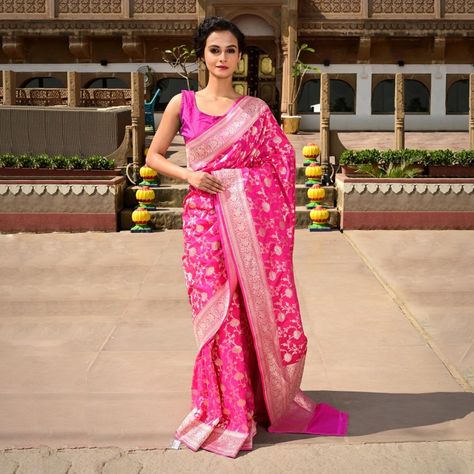 Women of India, immerse into the mesmerizing culture of Varanasi, where the scenic view of Ghats reveals a captivating tale of history. Every Katan saree beautifully narrates our rich cultural heritage that has endured through the ages. Step into the legacy of Varanasi and India by adorning this hot pink Banarasi Katan silk saree, becoming a modern embodiment of a timeless tradition. Grab hold of this exquisite piece and become a part of Varanasi's enduring charm, celebrating essence of India. Banarasi Katan Silk Saree, Katan Saree, Katan Silk Saree, Scenic View, Katan Silk, Banarasi Saree, Varanasi, Banarasi Sarees, Cultural Heritage