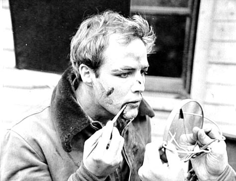 Marlon Brando on the set of ON THE WATERFRONT applying his own bloody, post-fight makeup. Elia Kazan, Stars D'hollywood, Bonnie Parker, Pier Paolo Pasolini, Turner Classic Movies, Mia 3, Marlon Brando, Catherine Deneuve, Movie Sets