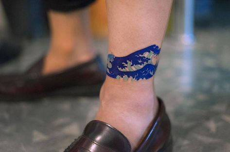 Japanese style wave tattoo inked around the left ankle Zihee Tattoo, Ankle Band Tattoo, Leg Band Tattoos, Pine Tattoo, Lilac Tattoo, Small Wave Tattoo, Hip Tattoo Small, Korean Tattoo, Rose Tattoo On Arm