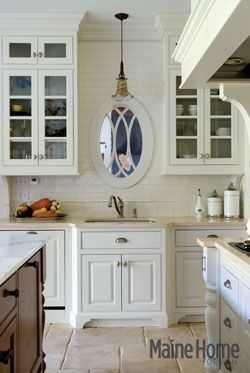 In Bar Harbor, rustic French farmhouse meets elegant country estate Blank Wall Over Kitchen Sink, Mirror In Front Of Kitchen Sink, Kitchen Sink In Front Of Wall, Windowless Kitchen Sink, Mirror Over Kitchen Sink, Sink With No Window, Window Above Kitchen Sink, Windowless Kitchen, Light Cabinets