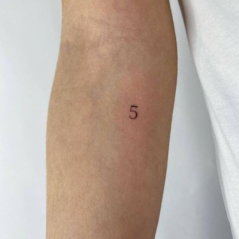 Number 5 tattooed on the inner forearm. Number 5 Tattoo, Minimalist Lettering, 9 Tattoo, 5 Tattoo, Mark 10 9, Tattoo Number, Tattoo Couple, Inner Forearm Tattoo, Tattoo Minimal