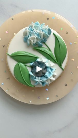 Hydrangea Cookie with Royal Icing | Two-toned blue hydrangea cookie decorated with royal icing for #floralfriday 💙

#hydrangea
#floralcookies
#flowers
#royalicing
#royalicingcookies... | By Butterfly Bakes ATLFacebook Hydrangea Cookies Decorated, Hydrangea Cookies, Hydrangea Cookie, Cookie Flooding, Cookie With Royal Icing, Royal Icing Transfers, Cookie Videos, Royal Icing Decorations, Flower Cookies