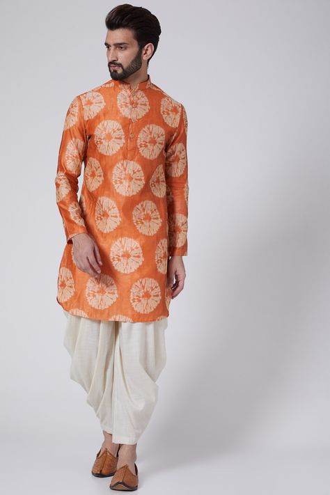 Featuring an orange kurta in woven silk base. It is paired with contrasting dhoti pants.    FIT: True to size.  COMPOSITION: Woven silk.  CARE: Dry clean only. Orange Kurta For Men, Silk Kurta Set, Kurta For Men, Kurta Set For Men, Dhoti Pants, Silk Kurta, Indian Fashion Designers, Pernia Pop Up Shop, Kurta Set