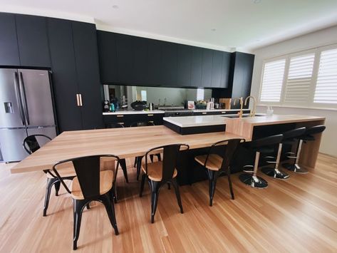 a sleek, modern kitchen perfect for entertaining 🍴 blackbutt timber creates a feature dining table connected to the island Integrated Table In Kitchen Island, Dining Table Connected To Kitchen Island, Island With Connected Table, Table Connected To Island, Kitchen Island Doubles As Dining Table, Kitchen Island Dining Table Hybrid, Kitchen Island Dining Table Combo, Timber Top Island Bench, Kitchen Island Dining Table