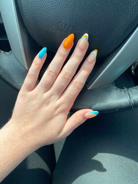 blue and orange acrylic nails with french tip design Blue And Orange Acrylic Nails, Orange Summer Acrylic Nails, Turquoise And Orange Nails, Nails With French Tip Design, Teal And Orange Nails, Orange And Blue Nails, F1 Nails, Nails With French Tip, Racing Nails