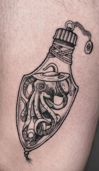 85 Unique Octopus Tattoos You'll Need To See - Tattoo Me Now Goth Octopus Tattoo, Octopus In A Bottle Tattoo, Octopus In A Jar Tattoo, Octopus Holding Things Tattoo, Squid Tattoo Design Simple, Octopus Hand Tattoos For Women, Female Octopus Tattoo, Vampire Squid Tattoo, Octopus Tattoo Meaning