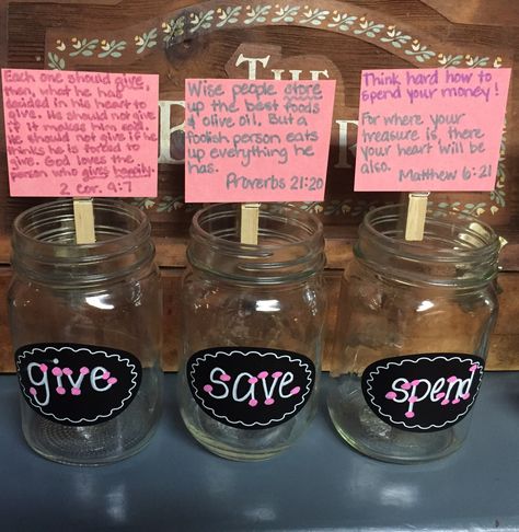 Our family's version of "Give-Save-Spend" jars to replace traditional piggy banks. Teaching our kids the principal of Biblical giving as well as the responsibilities of saving and spending wisely! Verses could be changed depending on your family, and the version we chose of the verses is from the International Children's Bible so it's in a wording that is easier to understand! Save Spend Tithe Jars, Spend Save Give Jars Diy, Change Jar Ideas, Chores And Allowance, Savings For Kids, Kids Money Management, Money Saving Jar, Change Jar, Family Command Center