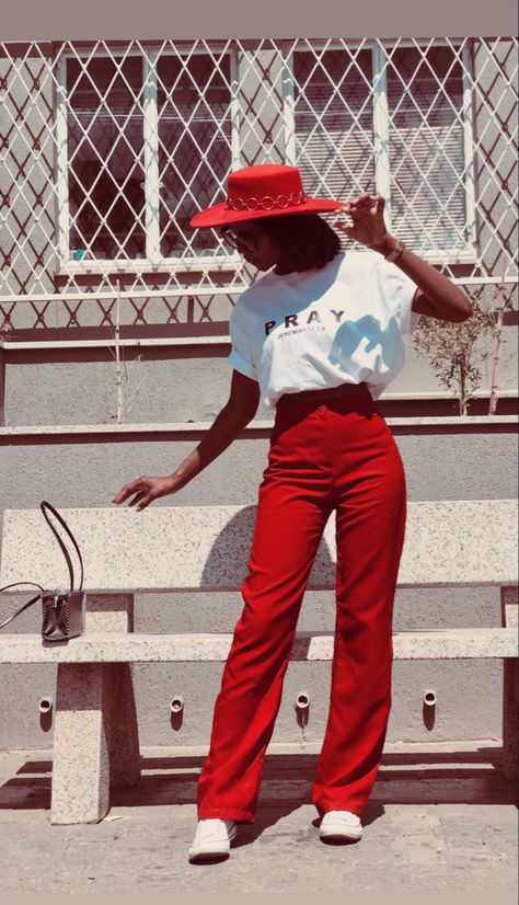 Red wide leg pants , white t shirt red hat and all stars. Red Shirt White Pants Outfit, Red Dress Pants Outfit, Red Pants Summer, Black White And Red Outfits, Red And Cream Outfit, Red Wide Leg Pants Outfit, Red Accent Outfit, Casual Red Wide-leg Pants, Baggy Red Wide-leg Pants