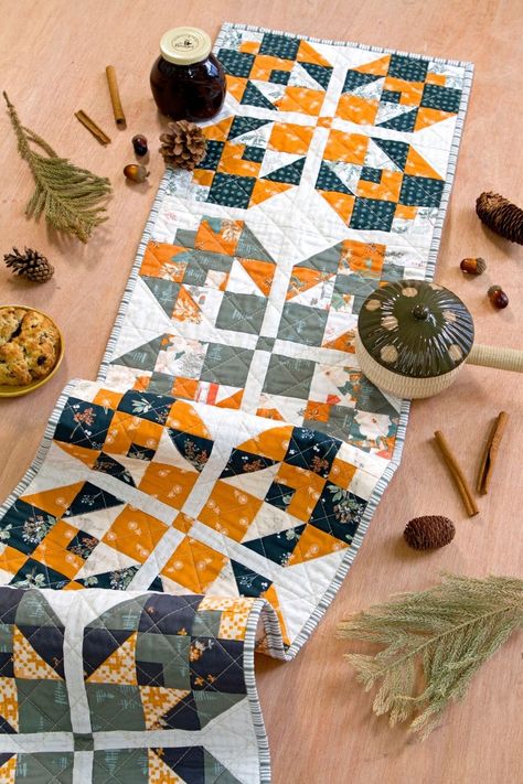 Infuse your fall gatherings with the heartwarming charm of the "Gather Here" table runner, made and designed by the talented Kristin Weiss of @heartlakequilts, adorned with exquisite prints from Juniper by Sharon Holland. It's the perfect handmade decor to infuse warmth into your family gatherings. Table Runner Hot Pad, Quilted Table Runner Pattern Free, Fall Table Runner Quilt Patterns, Fall Table Runner Pattern, Quilted Table Cloth, Quilted Table Runner Patterns Free, Sewn Table Runner, Free Quilted Table Runner Patterns, Charm Pack Table Runner Pattern Free