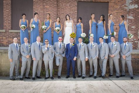 Grey Groomsmen Suits With Blue Bridesmaid Dresses, Gray And Blue Suits Wedding, Wedding Blue Suit Color Schemes, Dusty Blue And Gray Groomsmen Attire, Groom And Groomsmen Attire Dusty Blue, Groomsmen Attire Grey And Blue, Groom In Blue Groomsmen In Grey, Steel Blue And Grey Wedding, Wedding Party With Blue Suits