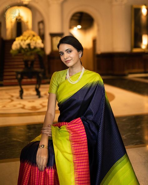 This karu Neelam Kanchipuram silk saree has vari woven all over the body and has pink and orange high court kattam woven alongside the border and is paired with Kili Pachai temple reku border. Kanchi Organza Sarees, Saree Color Combinations, Kanjivaram Sarees Silk, Bathroom Plans, Kanjivaram Saree, Desi Wedding Decor, Sarees Silk, Poses Women, Goddess Decor