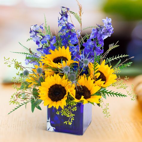 The essence of Land Meets Sky - nothing but brilliant blue sky above and fields of sunflowers below. Do you see how flowers inspire us? Visit our website to order these beauties!	 #ihavethisthingwithflowers #sayitwithflowers #flowerperfection #beautifulblooms #flowersmakemehappy #cremerflorist #hanoverflorist #hanoverflowers #hanoverpa #hanoverpennsylvania Cube Vase, Arrangement Flowers, Get Well Flowers, Sunflower Themed Wedding, Hand Flower, Flower Delivery Service, Flower Cart, Anniversary Flowers, Seeded Eucalyptus