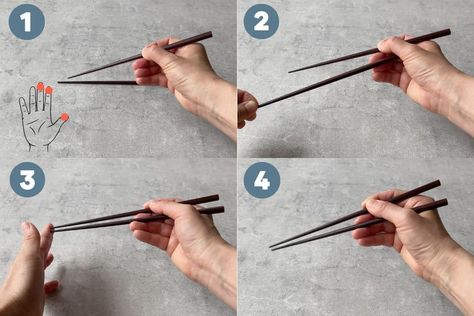 Looking to learn how to hold chopsticks? With these easy steps and helpful tips, you'll be confidently using chopsticks at the dinner table in no time. How To Hold Chopsticks, Hold Chopsticks, How To Use Chopsticks, Using Chopsticks, Household Help, Japanese Chopsticks, Chopstick Rest, Lunch To Go, Japanese Restaurant